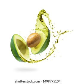 Sliced avocado with splashes isolated on white background - Shutterstock ID 1499775134