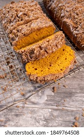 sliced baked pumpkin streusel loafs with icing drizzle