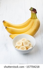 Sliced Banana In Bowl On Wooden Table