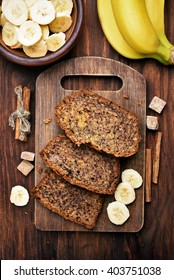 Sliced Banana Bread On Wooden Cutting Board, Top View