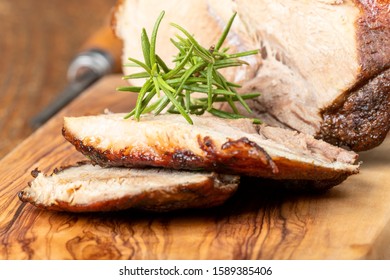 sliced bavarian roasted pork on wood 