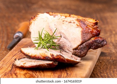 sliced bavarian roasted pork on wood