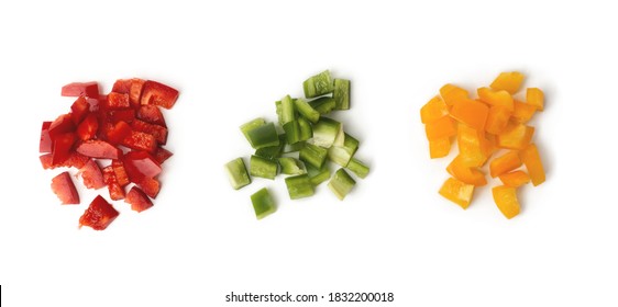 Sliced bell pepper, chopped tricolor сolorful bulgarian pepper. Three heap of red, green and yellow separately isolated on white background. Top view. - Powered by Shutterstock