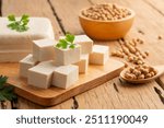 Sliced block tofu,Hard white Tofu soy bean curd on a wooden plate.
