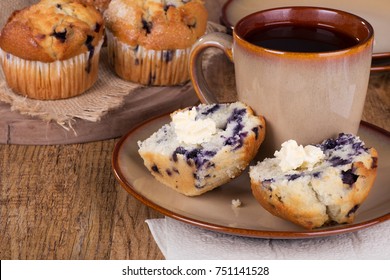 Sliced Blueberry Muffin And Butter With A Cup Of Coffee On A Plate