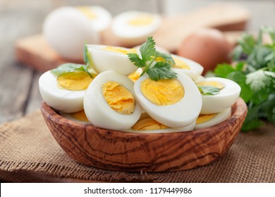 Sliced boiled eggs,decorated with parsley leaves.