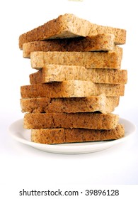 Sliced bread close up on a white plate. white background