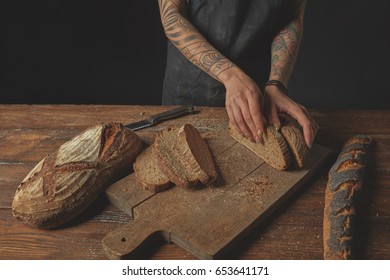 Sliced bread on a board - Shutterstock ID 653641171