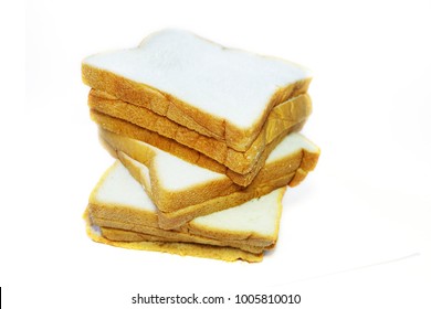 Sliced Bread.Multiple Sheets Vertical Alignment.On A White Background. It Is Made From Wheat Flour Mixed With Water And Yeast Or Baking Powder. Can Be Used As A Background Image For Food And Cakes.