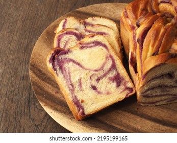 Sliced Brioche Babka With Purple Sweet Potato Filling On Wood