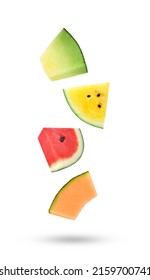 Sliced of cantaloupe melon and watermelon falling in the air isolated on white background.