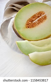 Sliced Cantaloupe melone on light textured background - Shutterstock ID 1158453817