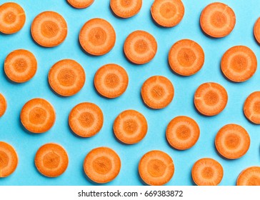 Sliced Carrot On Blue Color Background