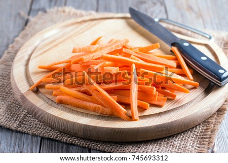 Sliced carrots on a cutting board