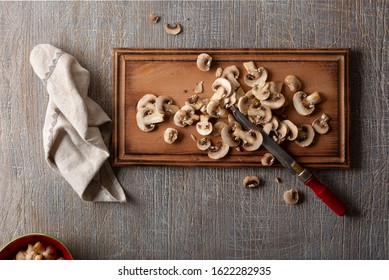 Sliced Champignons On A Cutting Board. Top View. Ecofriendly Food. Keto Diet.