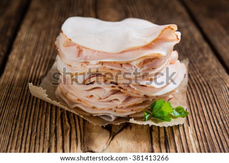 Sliced Chicken Breast fillet (selective focus) on wooden background Сток-фото © 
