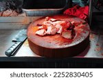 Sliced Chinese Barbeque Red Pork on Wooden Chopping block