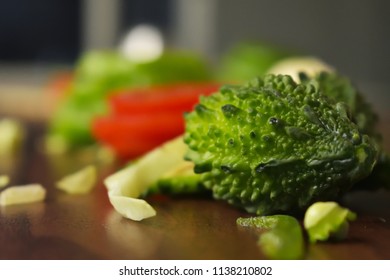 Sliced & Chopped Bitter Gourd  On The Wooden Background Free Royalty Free Stock Images