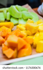 Sliced Chunks Of Pineapple, Cantaloupe, Papaya, Mango And Honeydew Melon