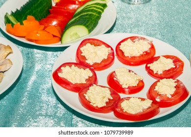 Sliced In Circle Tomatoes With Cottage Cheese Or Cheese On White Plate. Cold Snack On Buffet Table. Side View And Copy Space.