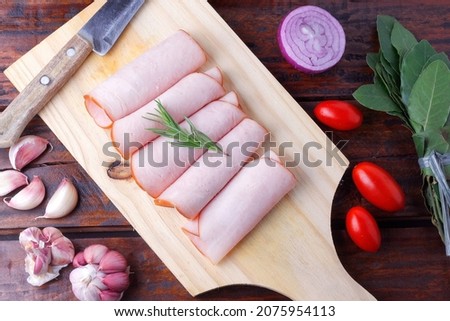 sliced cold smoked turkey breast over rustic wooden table. top view Сток-фото © 
