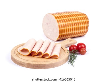 Sliced Cooked Turkey Breast On Cutting Board With Some Cherry Tomatos On White Background