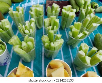 Sliced Cucumber And Pineaplle, Healthy Vegetarian, Vegan Snack, Street Food Stall In Asia.