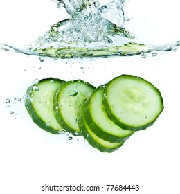 Sliced Cucumber Splashing Water Isolated On White Background