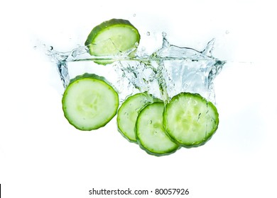 Sliced Cucumber Splashing Water Isolated On White Background