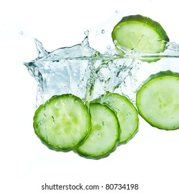 Sliced Cucumber Splashing Water Isolated On White Background