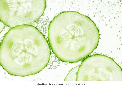 sliced cucumbers float on the surface of the water - Shutterstock ID 2355599029