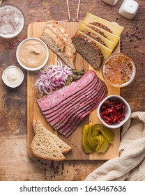 Sliced Deli Pastrami On Wooden Board, Flat Lay