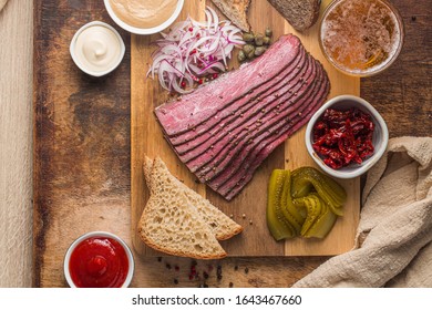 Sliced Deli Pastrami On Wooden Board, Flat Lay