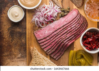 Sliced Deli Pastrami On Wooden Board, Flat Lay