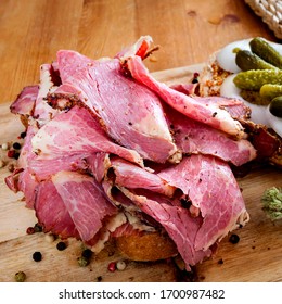 Sliced Deli Pastrami On Wooden Board