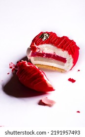 Sliced Dessert In The Form Of A Red Heart With Caramel, Jelly And Gold Leaf On A White Background