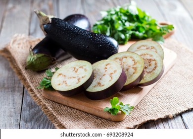 Sliced eggplant on wooden cutting board