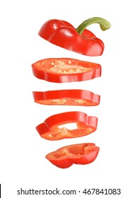 Sliced And Falling Red Pepper Isolated On White Background