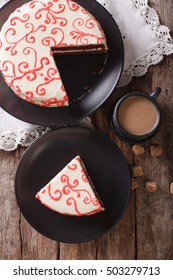 Sliced Festive Red Velvet Cake And Coffee Close-up On The Table. Vertical View From Above
