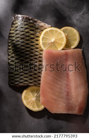 Sliced fillet of fresh carp fish, food ingredients
