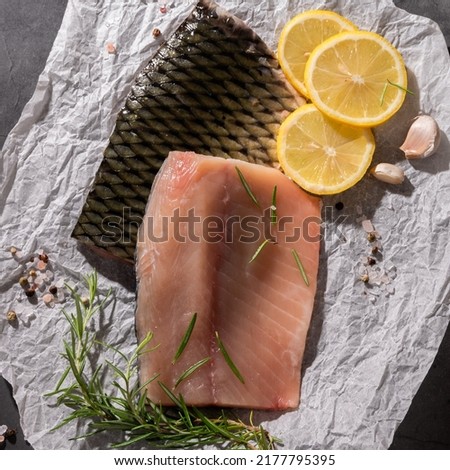Sliced fillet of fresh carp fish, food ingredients