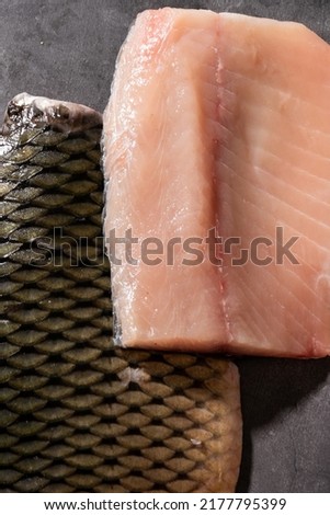 Sliced fillet of fresh carp fish, food ingredients
