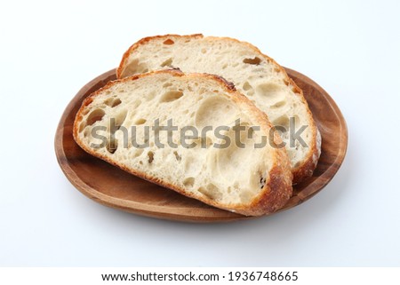 sliced french bread pain de campagne isolated on white background
