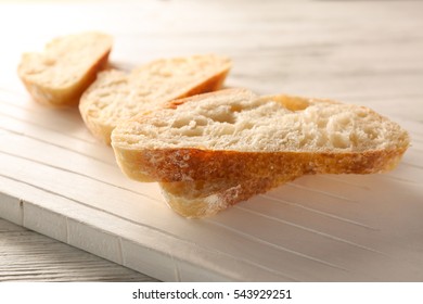 Sliced Fresh Bread On Wooden Background