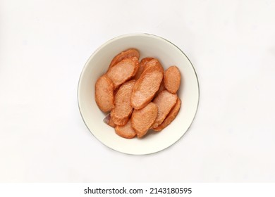 Sliced Fried Beef Sausage Served On Small Plate Isolated On White Background 