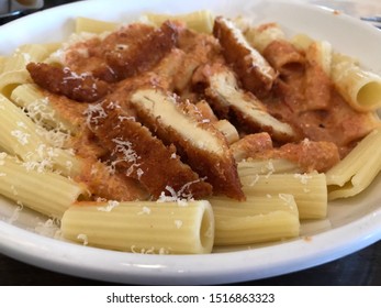 Sliced, Fried Chicken Cutlet Over Rigatoni With A Cheesy Marinara Sauce