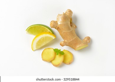 sliced ginger with lemon and lime on white background - Powered by Shutterstock