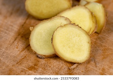 sliced ginger root on the table, closeup of the ginger root used in cooking - Powered by Shutterstock