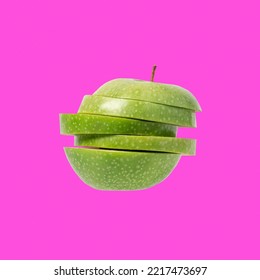 Sliced Green Apple Flying In The Air On Bright Purple Background. Isolated Granny Apple