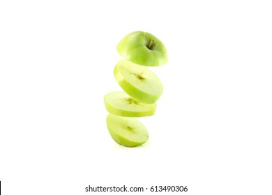  Sliced Green Apple Flying On White Background. Floating In The Air. Isolate .